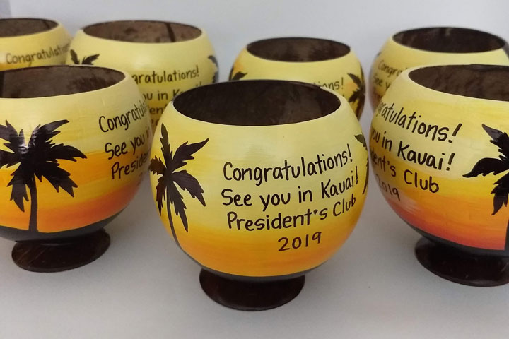 Painted coconuts make incentive trip invitations